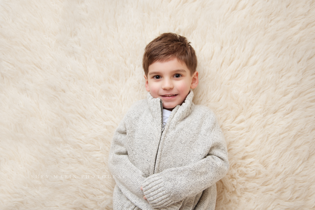 boy on rug in studio | frederick family photographer