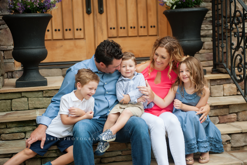 Frederick family in front of beautiful home