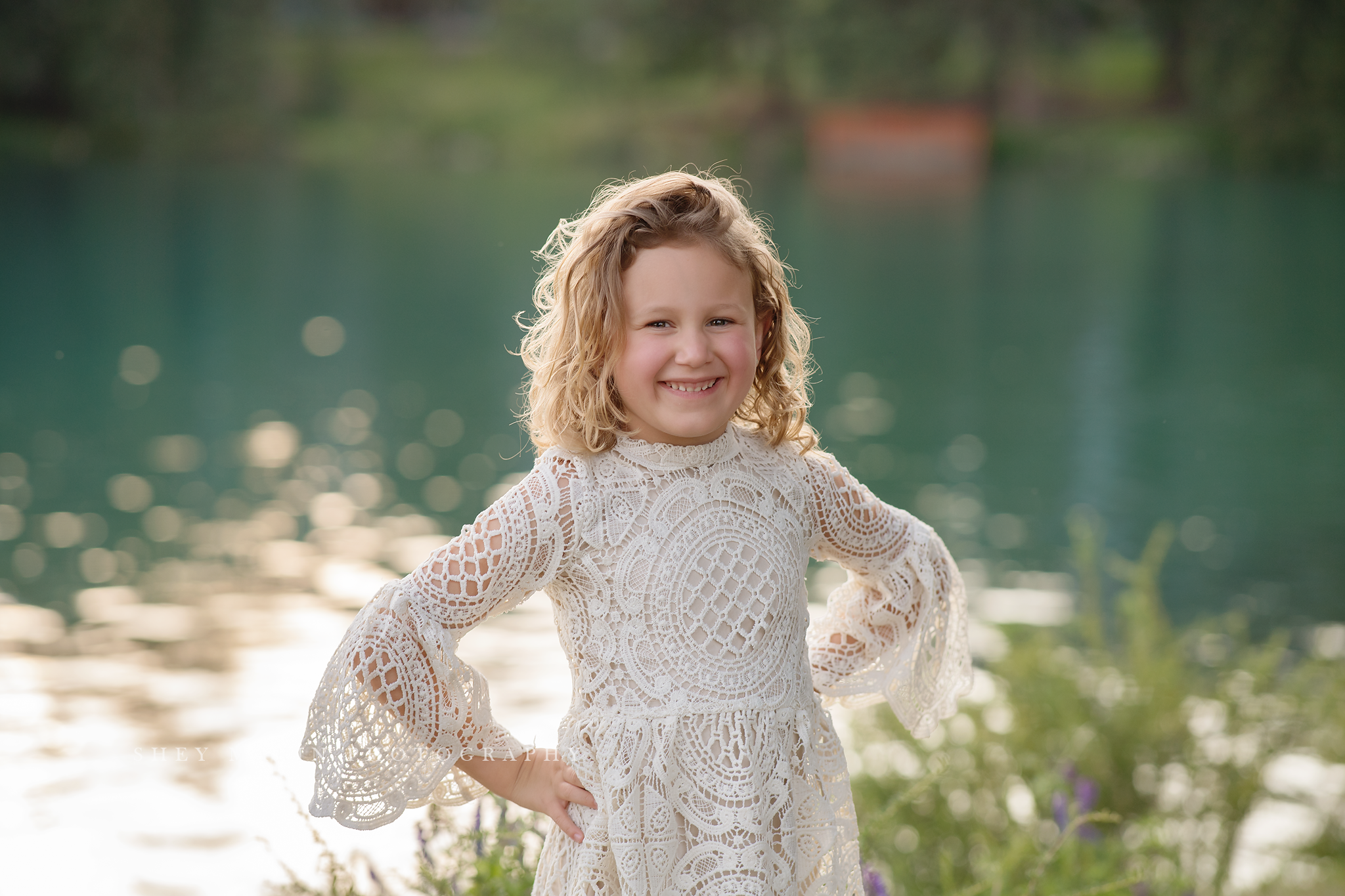 travel family photo session girl in lace dress by lake