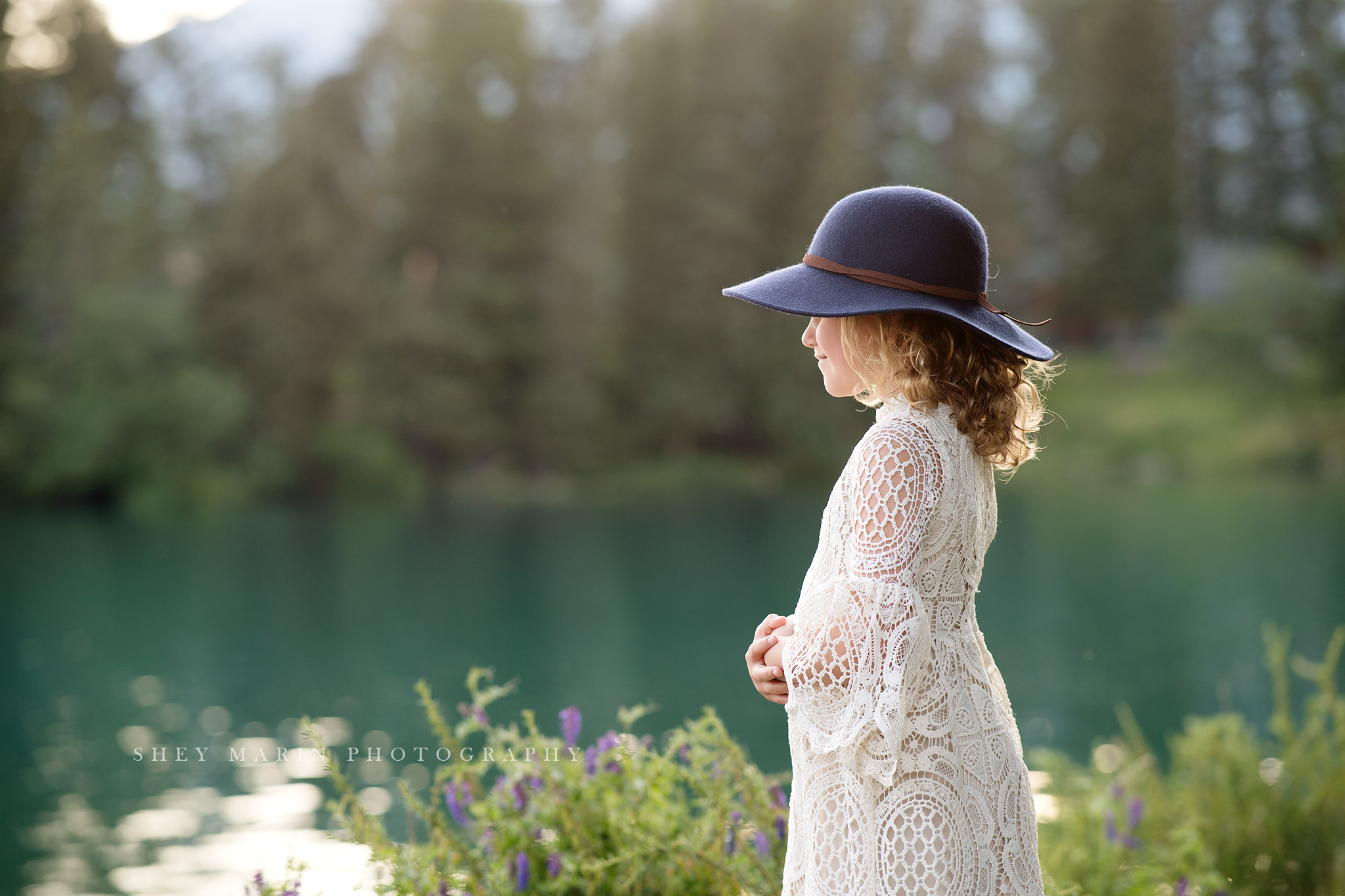 travel family photo session girl in lace dress by lake anne of green gables