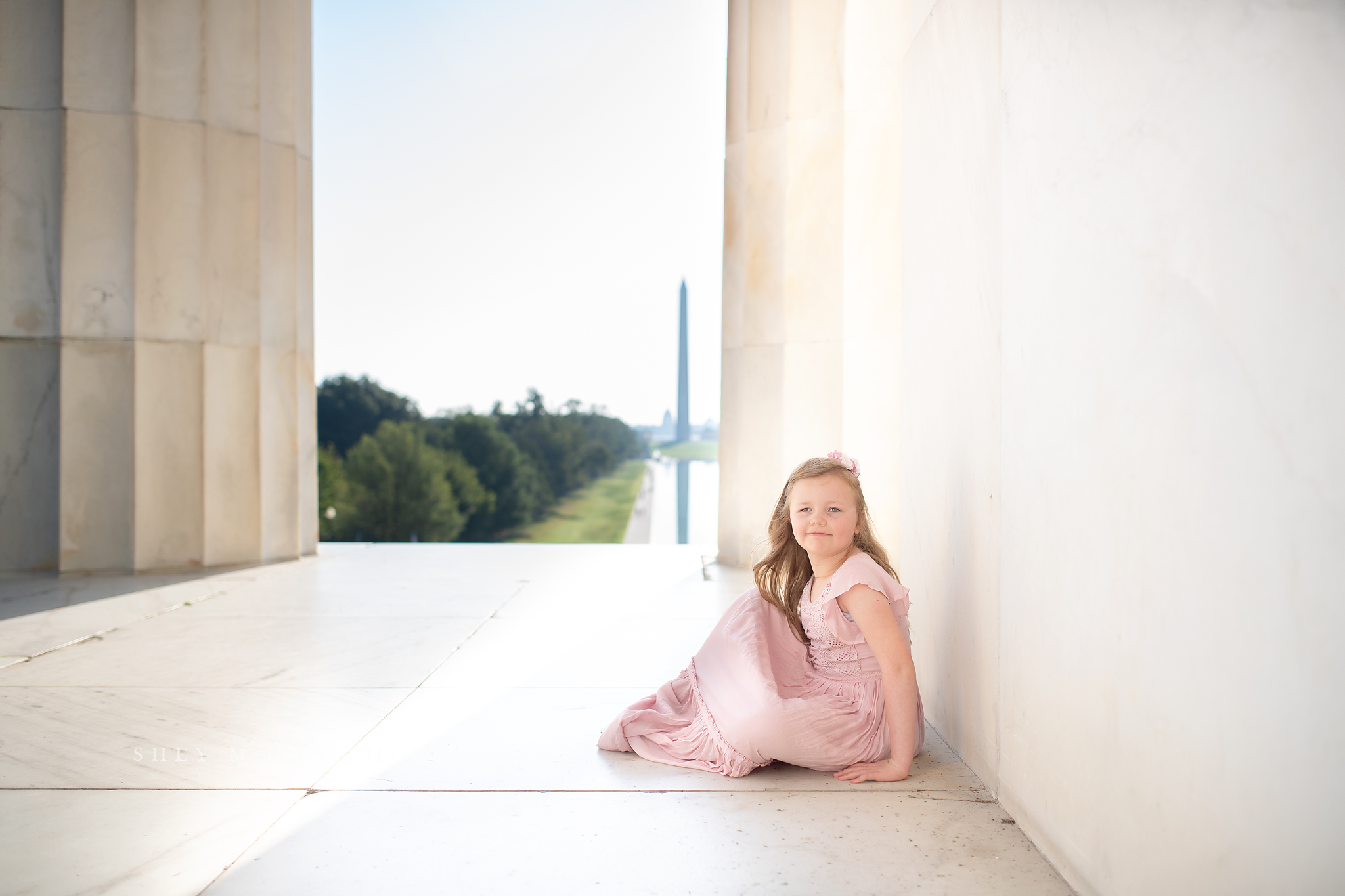 girl sitting on lincoln memorial marble