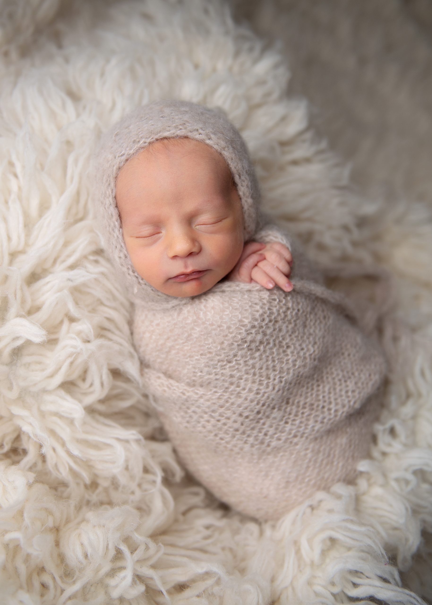 newborn baby swaddled