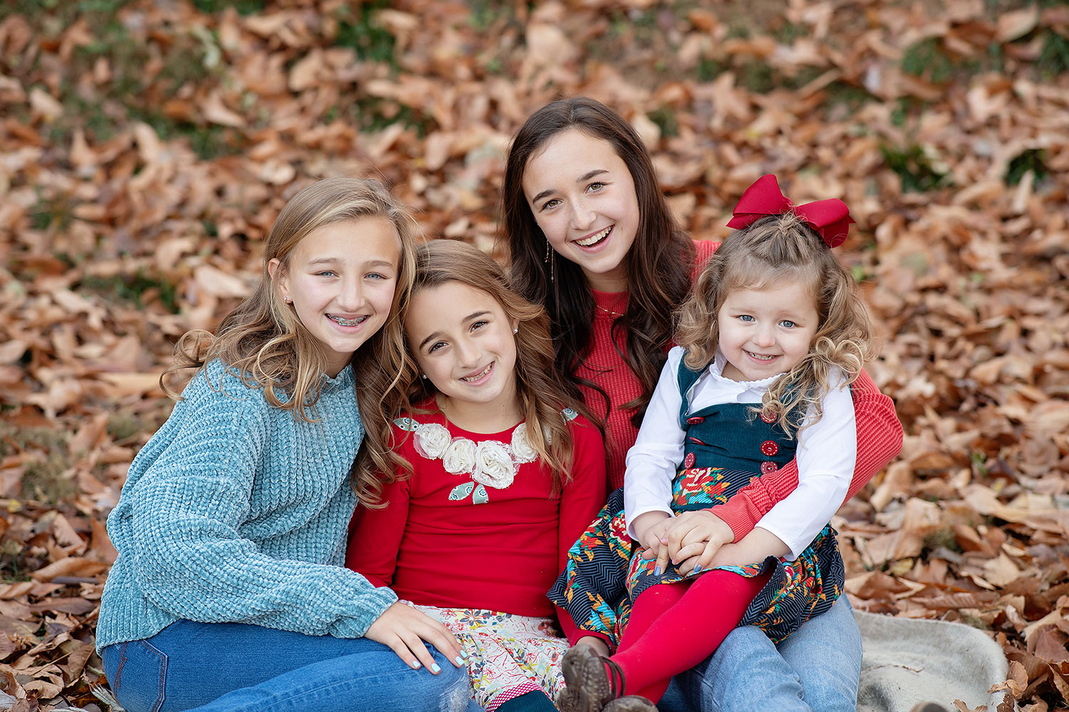 four sisters in leaves